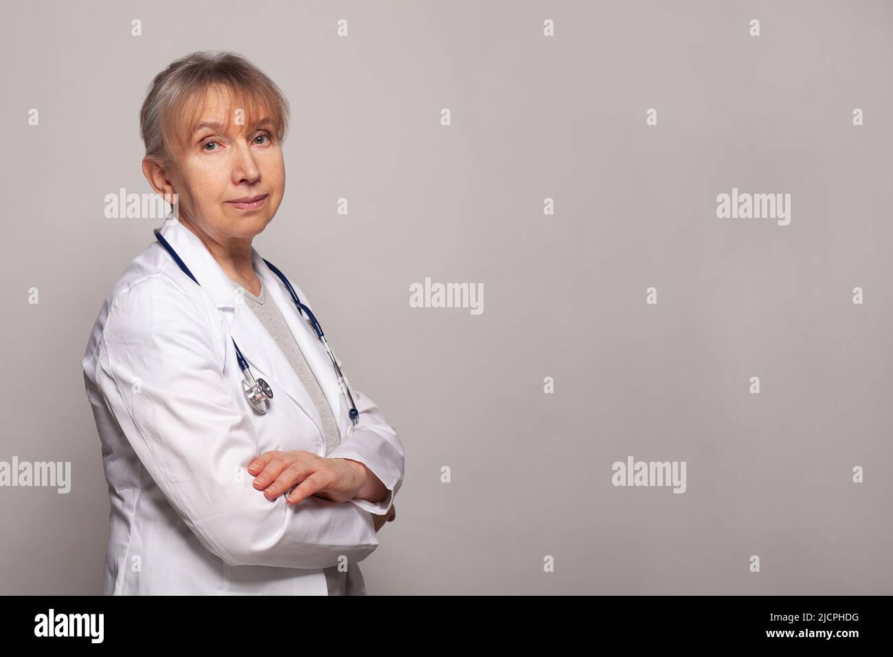 Female senior nurse arms crossed hi-res stock photography and images ...