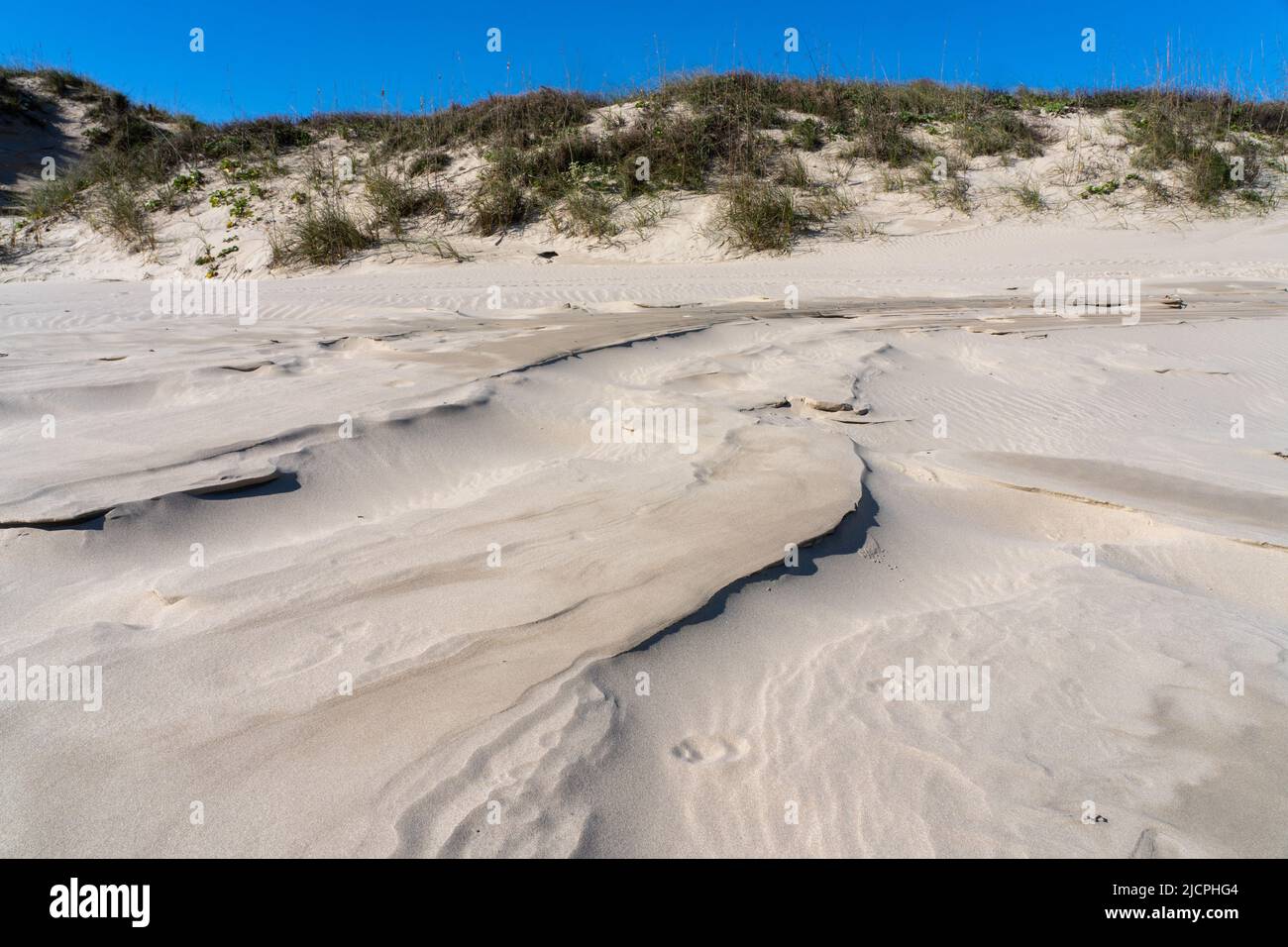 HIgh tide wave patterns left in the sand in front of the foredunes on South Padre Island, Texas. Stock Photo