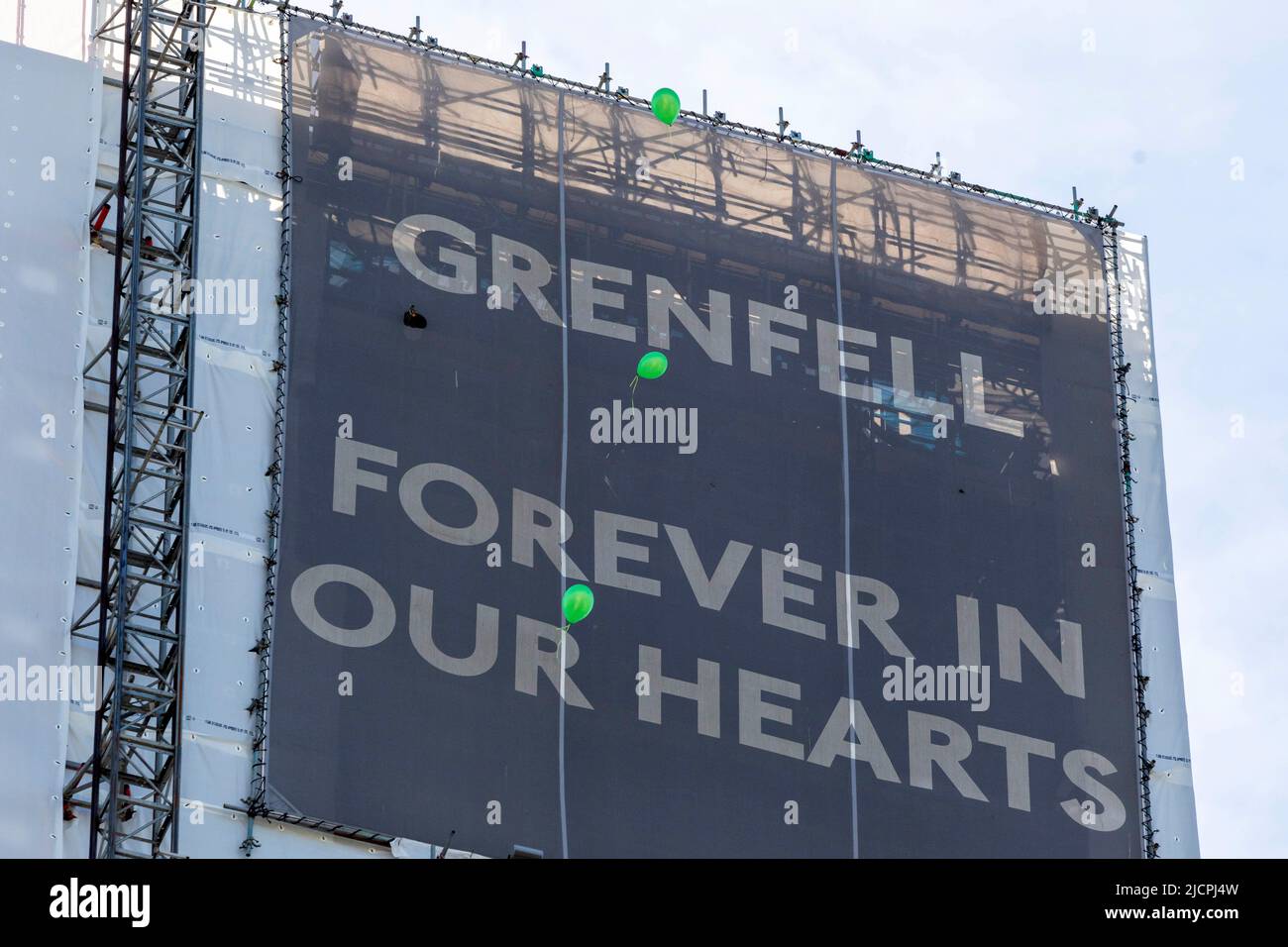 A memorial service is held at Grenfell Tower to commemorate the 5th