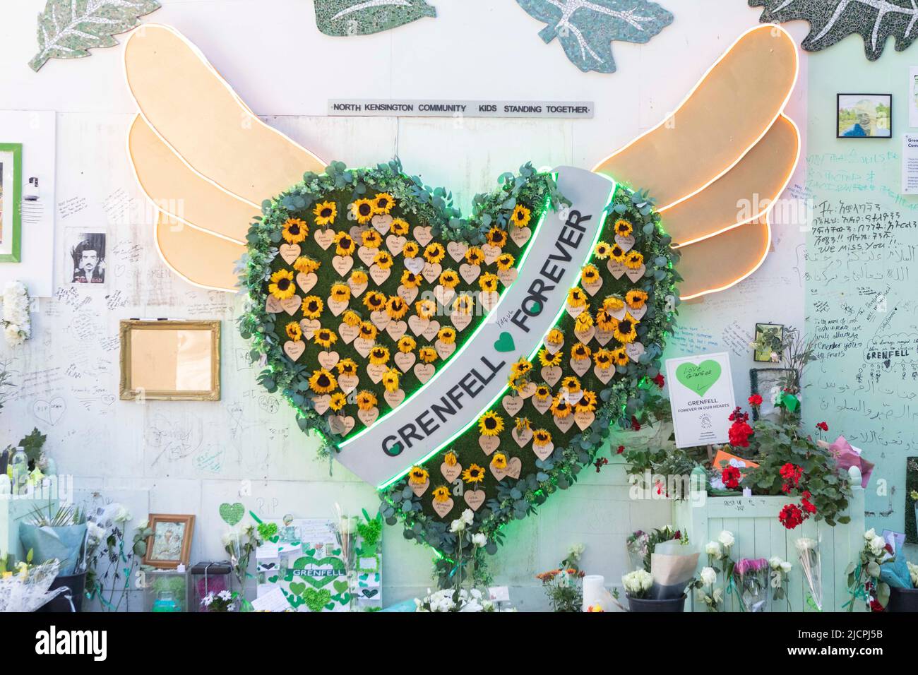 A memorial service is held at Grenfell Tower to commemorate the 5th