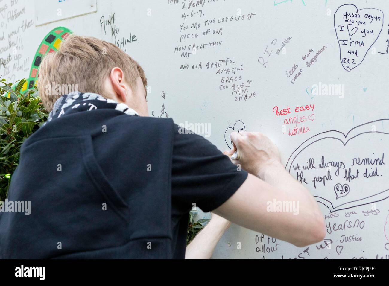 A memorial service is held at Grenfell Tower to commemorate the 5th