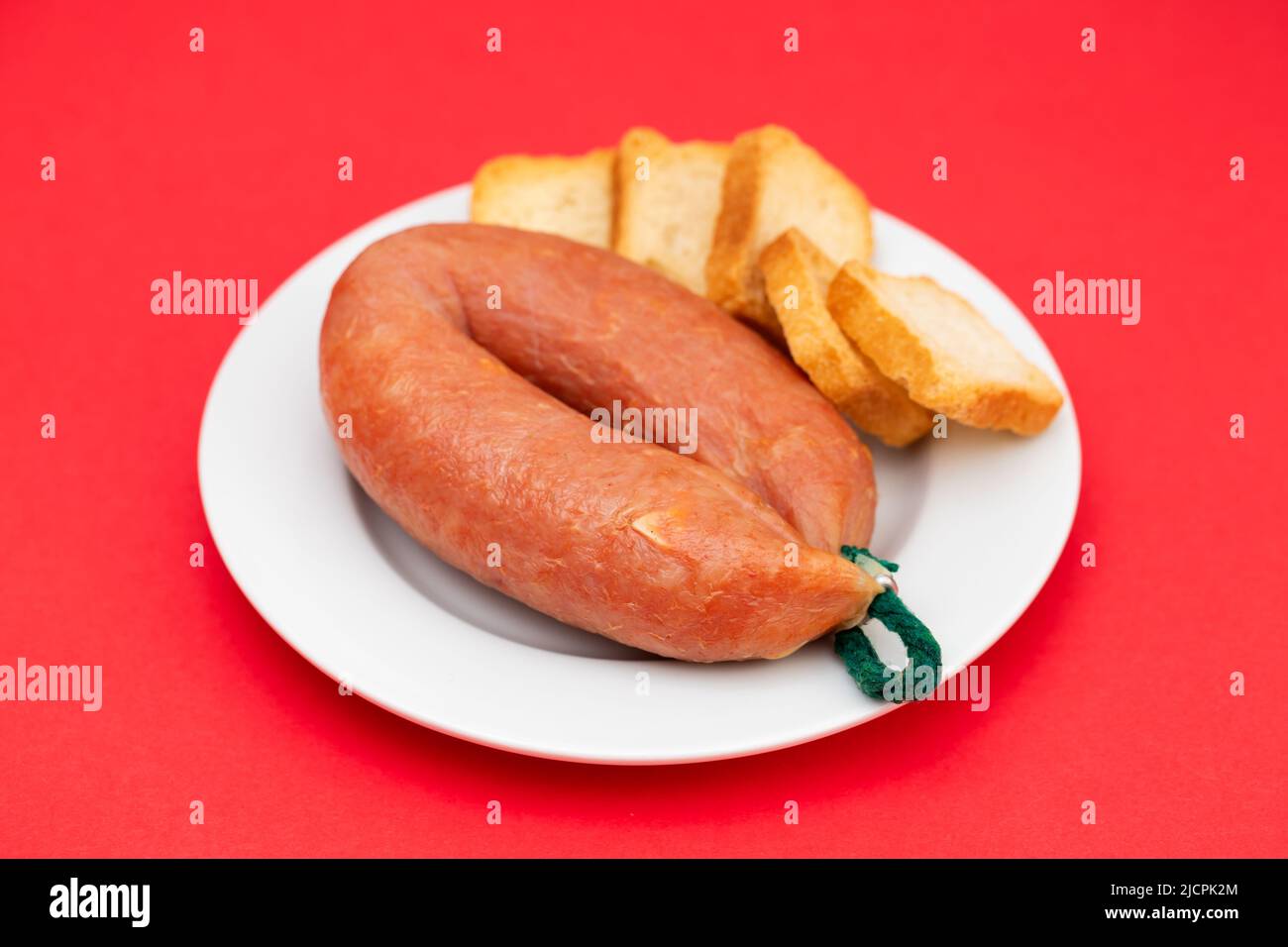typical portuguese smoked sausage with toasts on dish Stock Photo Alamy