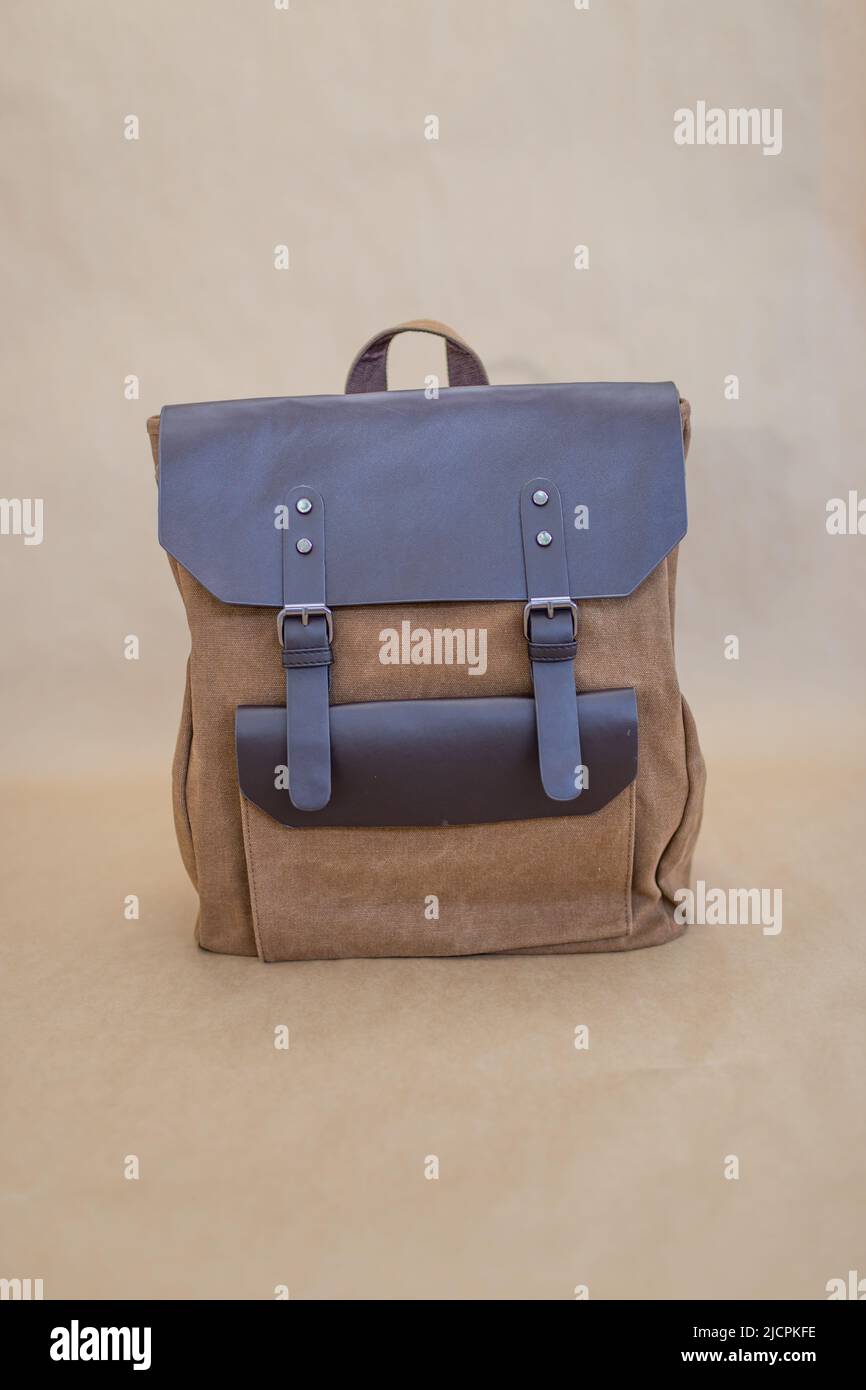 Canvas backpack isolated on beige background. Unisex bag Stock Photo