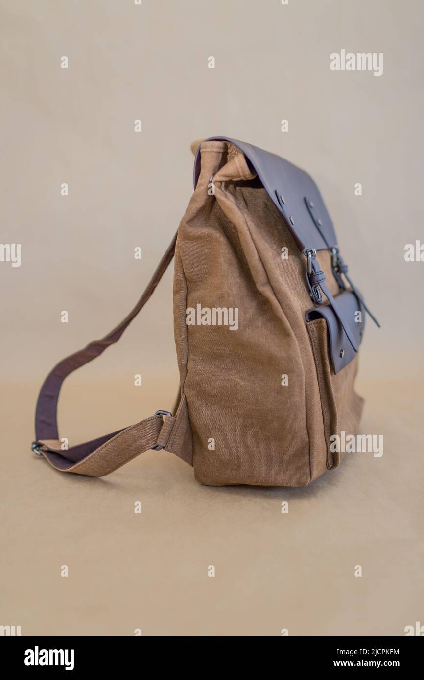 Canvas backpack isolated on beige background. Unisex bag Stock Photo