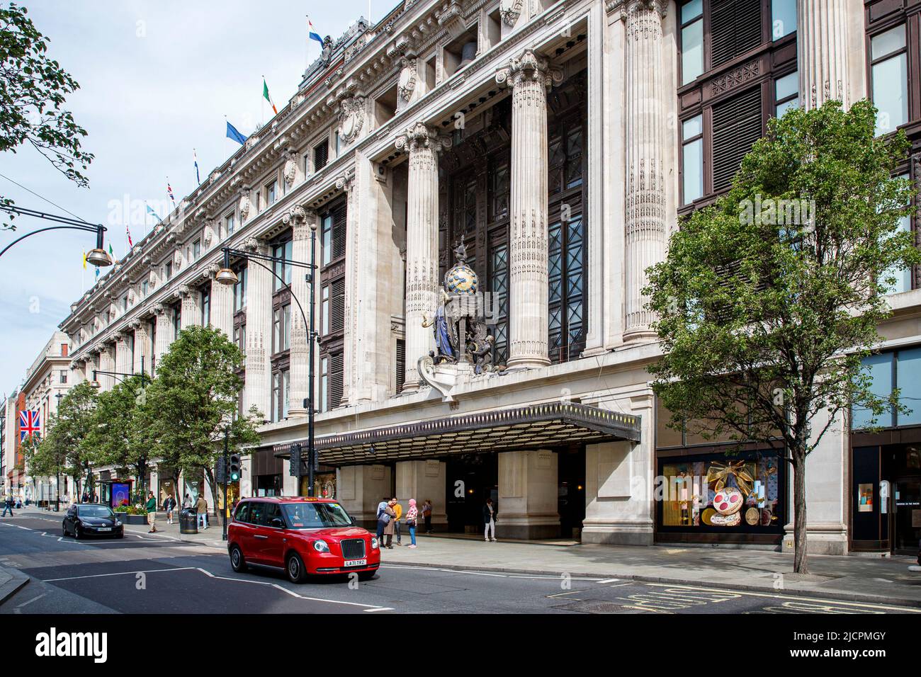 The Queen of Time clock bronze sculpture by Gilbert Bayes above the Selfridges entrance in Oxford Street, London, England, United Kingdom Stock Photo