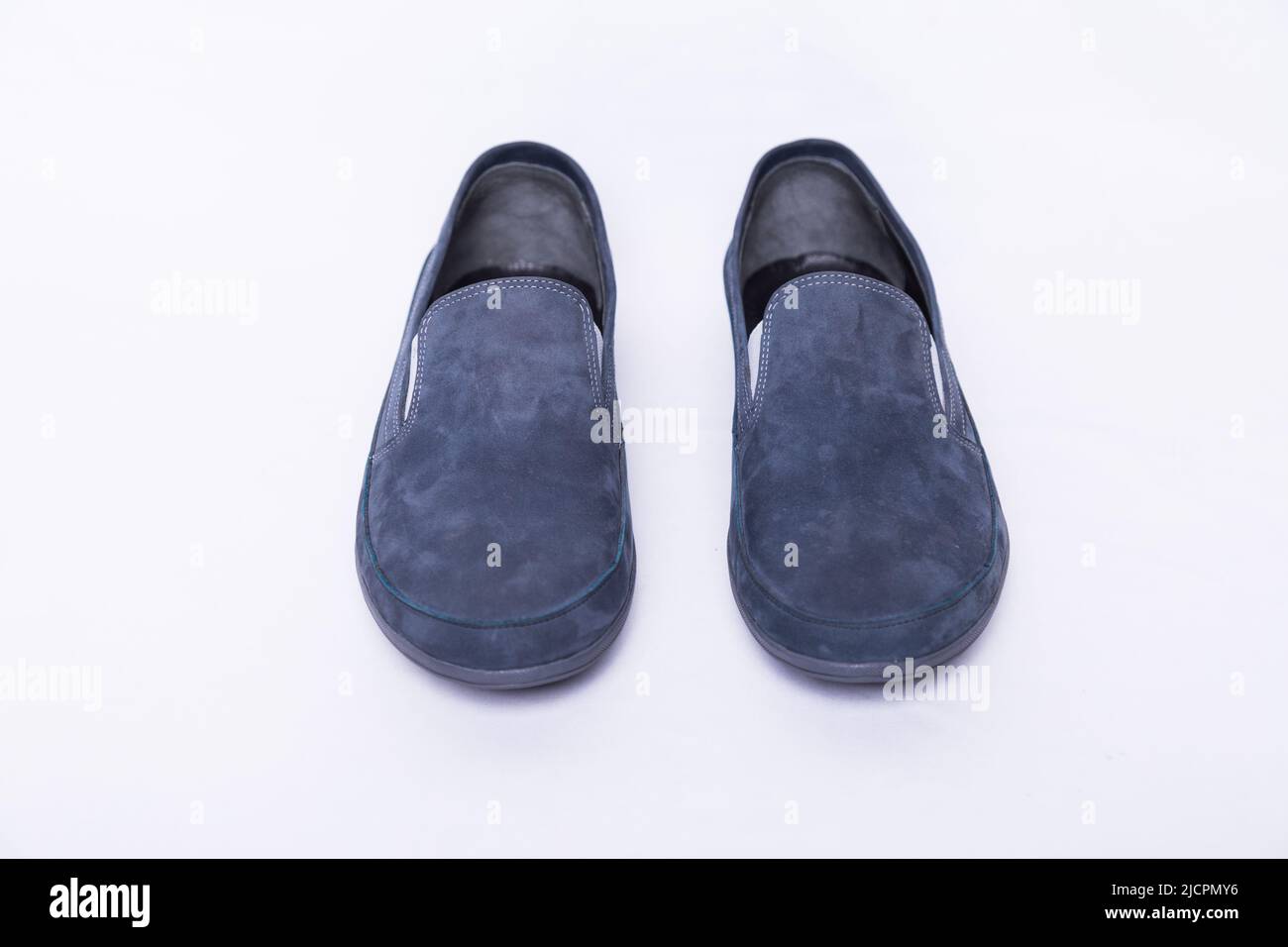 Men's Sky blue nubuck slip ons shoes on a white background Stock Photo