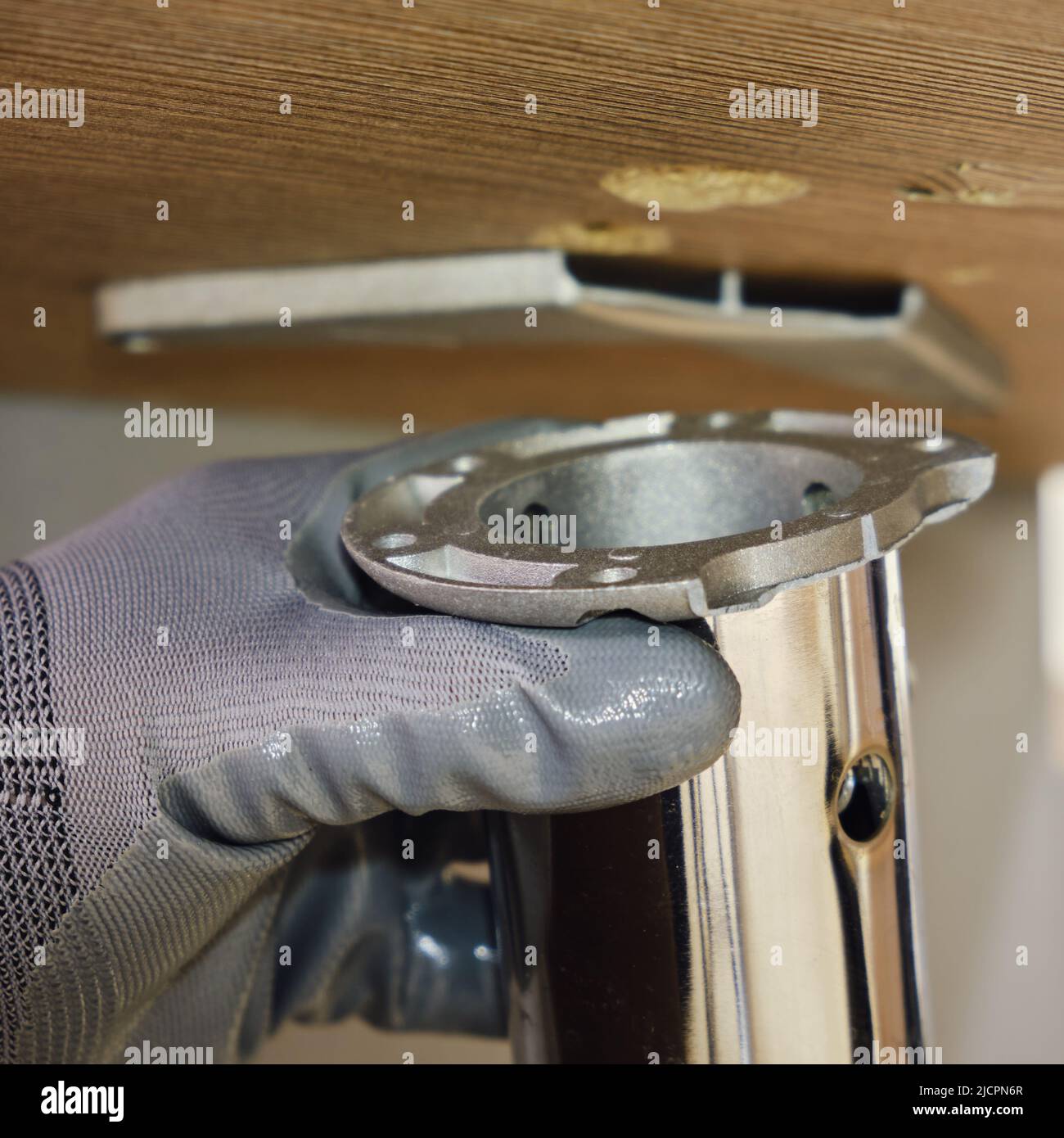 Broken leg of an office desk, repair of furniture made of wood and