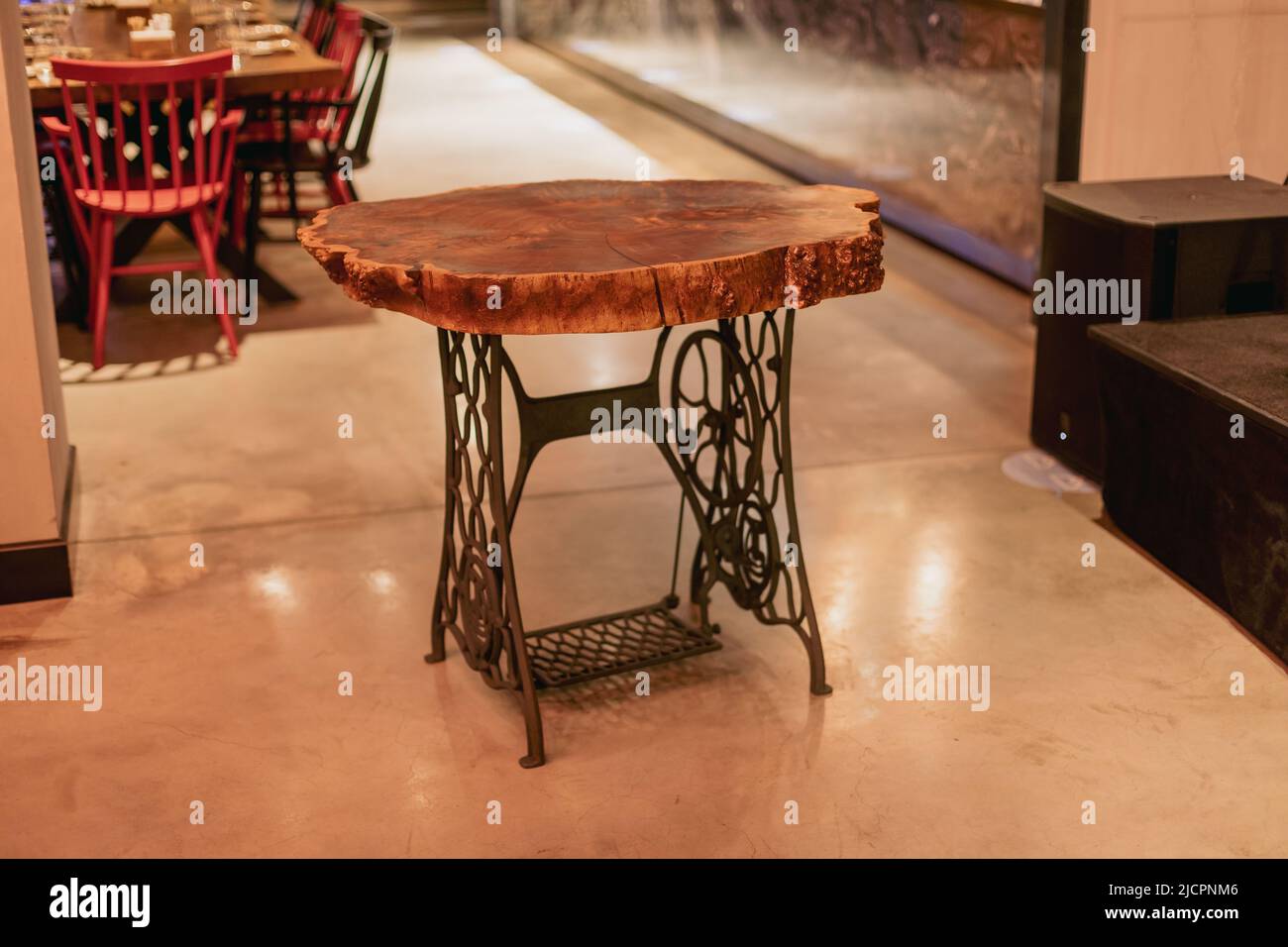 Handmade epoxy resin round wood table. Reclaimed wood furniture and live edge table made from fallen trees Stock Photo