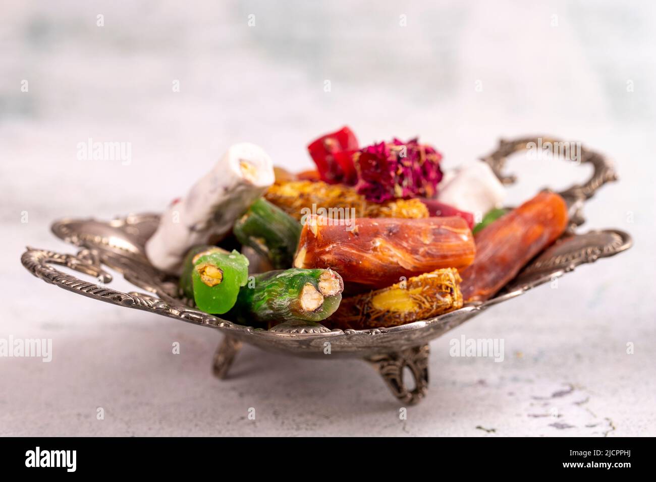 Turkish delight varieties in an iron bowl. Traditional Turkish