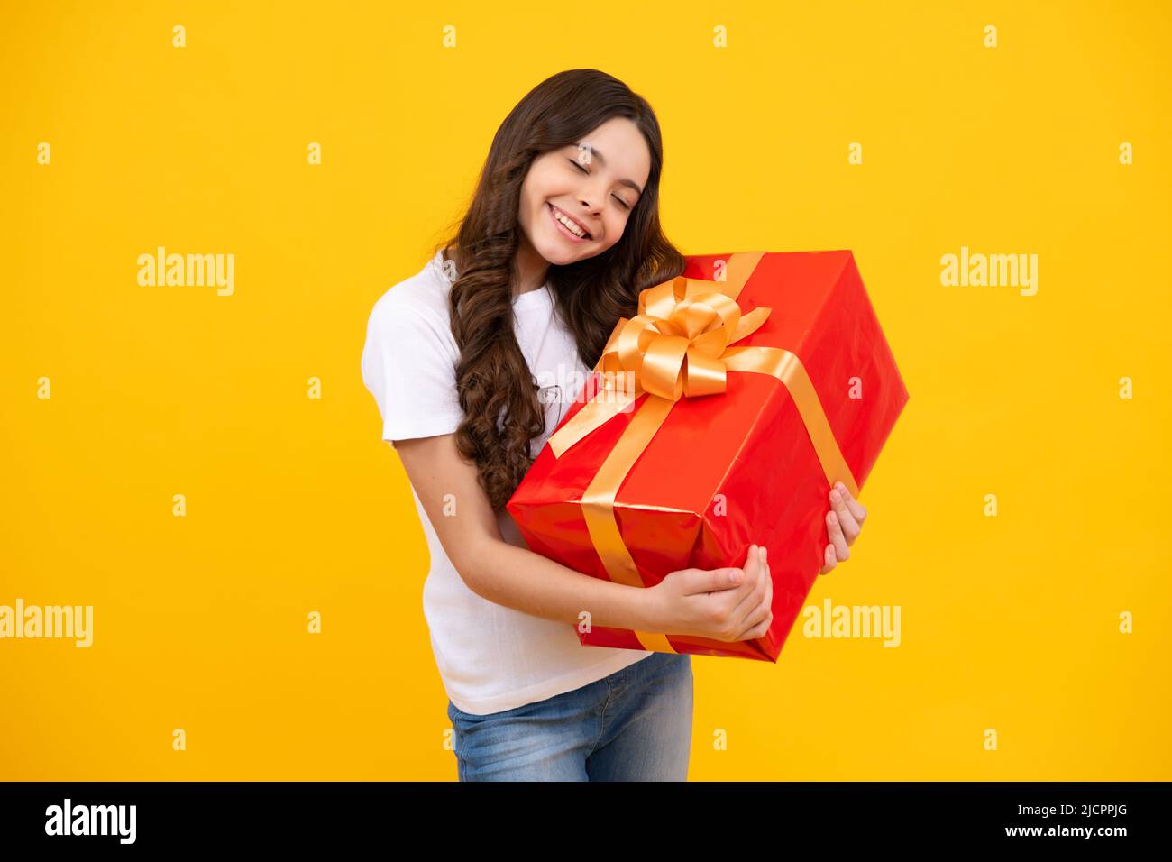 Portrait of teenager child girl 12, 13, 14, years old holding Christmas