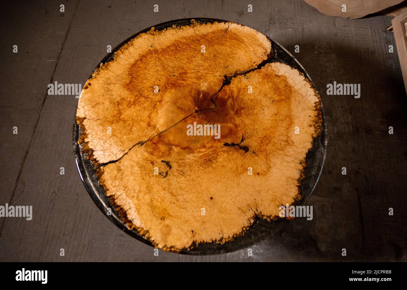 Epoxy resin round table in workshop Stock Photo - Alamy