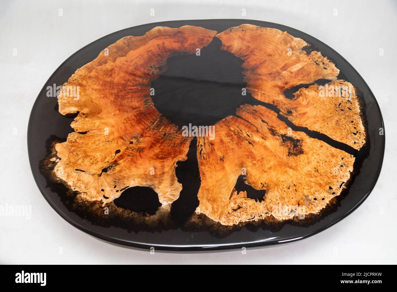 Epoxy resin round table on a white background Stock Photo - Alamy