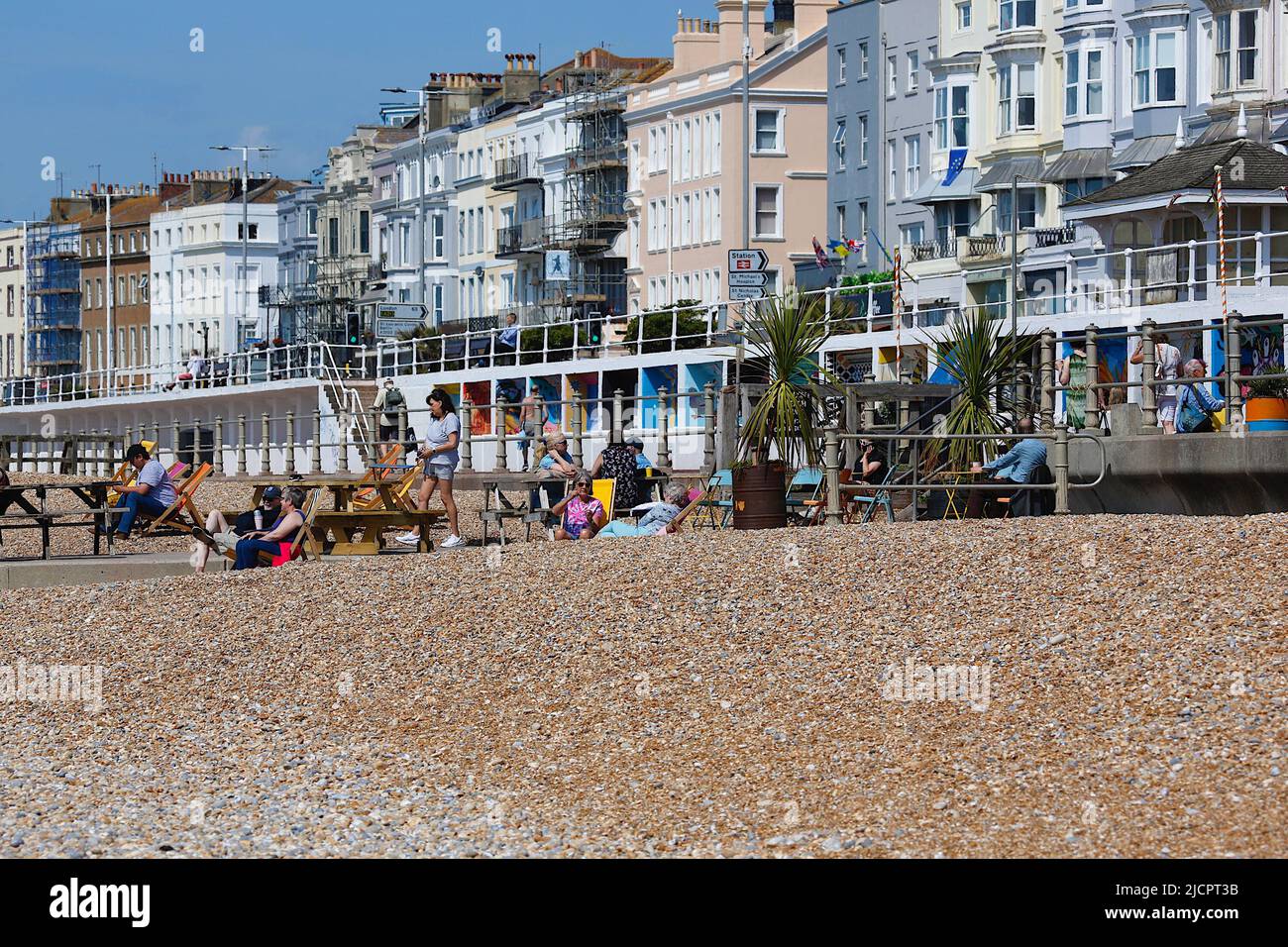 Hastings, East Sussex, UK. 15 Jun, 2022. UK Weather: Hot and sunny at the seaside town of Hastings in East Sussex as Brits enjoy the warm weather today along the seafront promenade. Busy beach cafe. Photo Credit: Paul Lawrenson /Alamy Live News Stock Photo