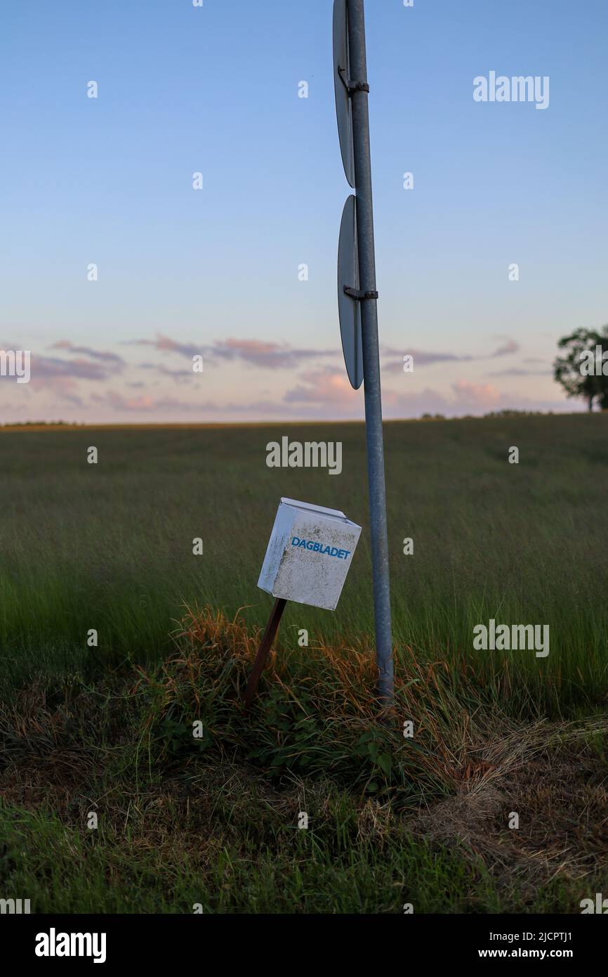 Falling mailbox at sunset Stock Photo - Alamy