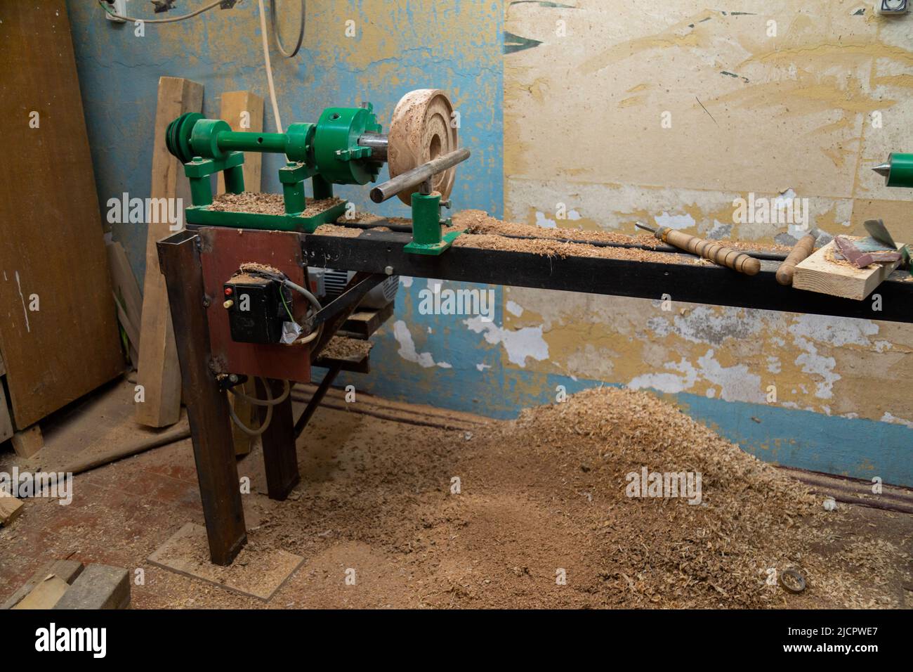 Lathe machine with wooden turning blanks in Stock Photo Alamy