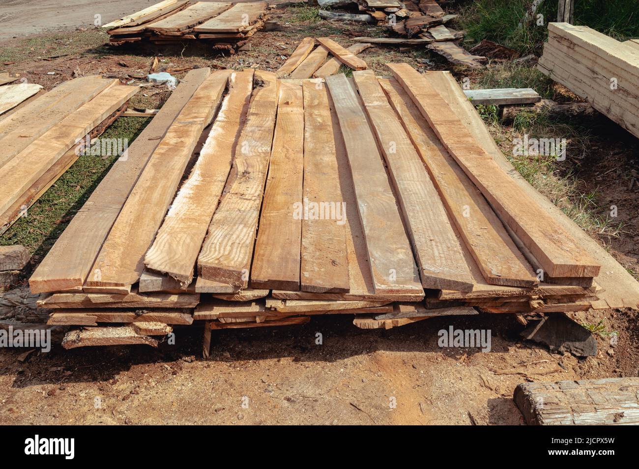 Stacked lumber. Folded wood.Closeup wooden boards. Wood planks stacked