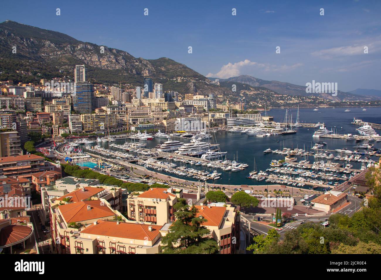 Panoramic aerial view of Monaco and Port Hercule, sweeping views of the city, mountains and harbor, luxury yachts and apartments in La Condamine Stock Photo
