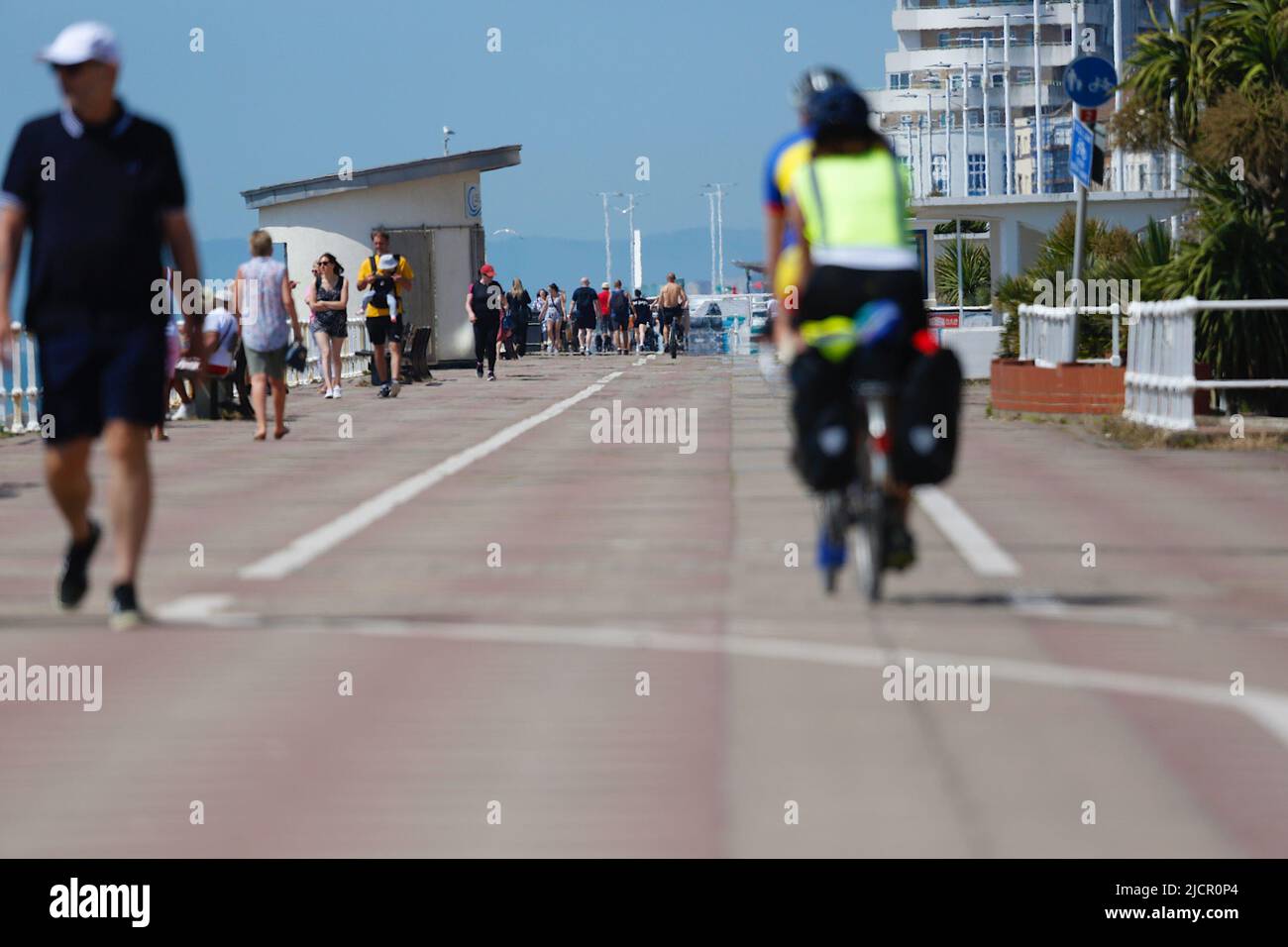 Hastings, East Sussex, UK. 15 Jun, 2022. UK Weather: Hot and sunny at the seaside town of Hastings in East Sussex as Brits enjoy the warm weather today along the seafront promenade. Photo Credit: Paul Lawrenson /Alamy Live News Stock Photo