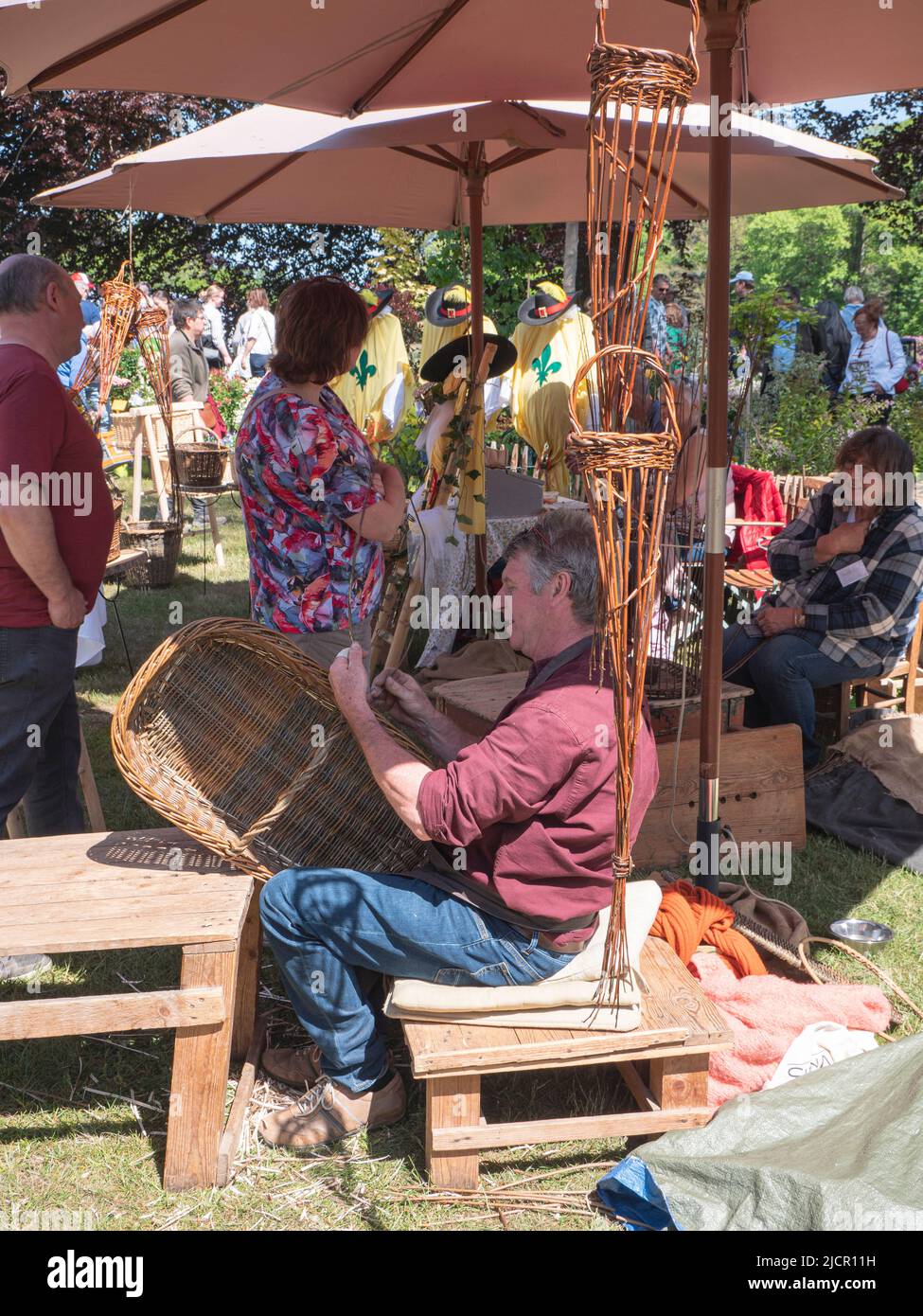 Beervelde, Belgium, 08 May 2022, Basket weaver gives a demonstration on an open garden day Stock Photo