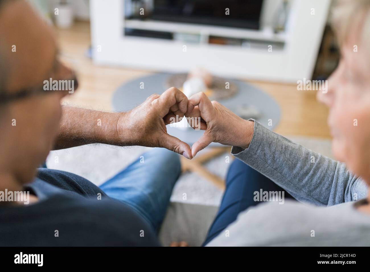 Happy romantic senior couple in love bonding at home Stock Photo