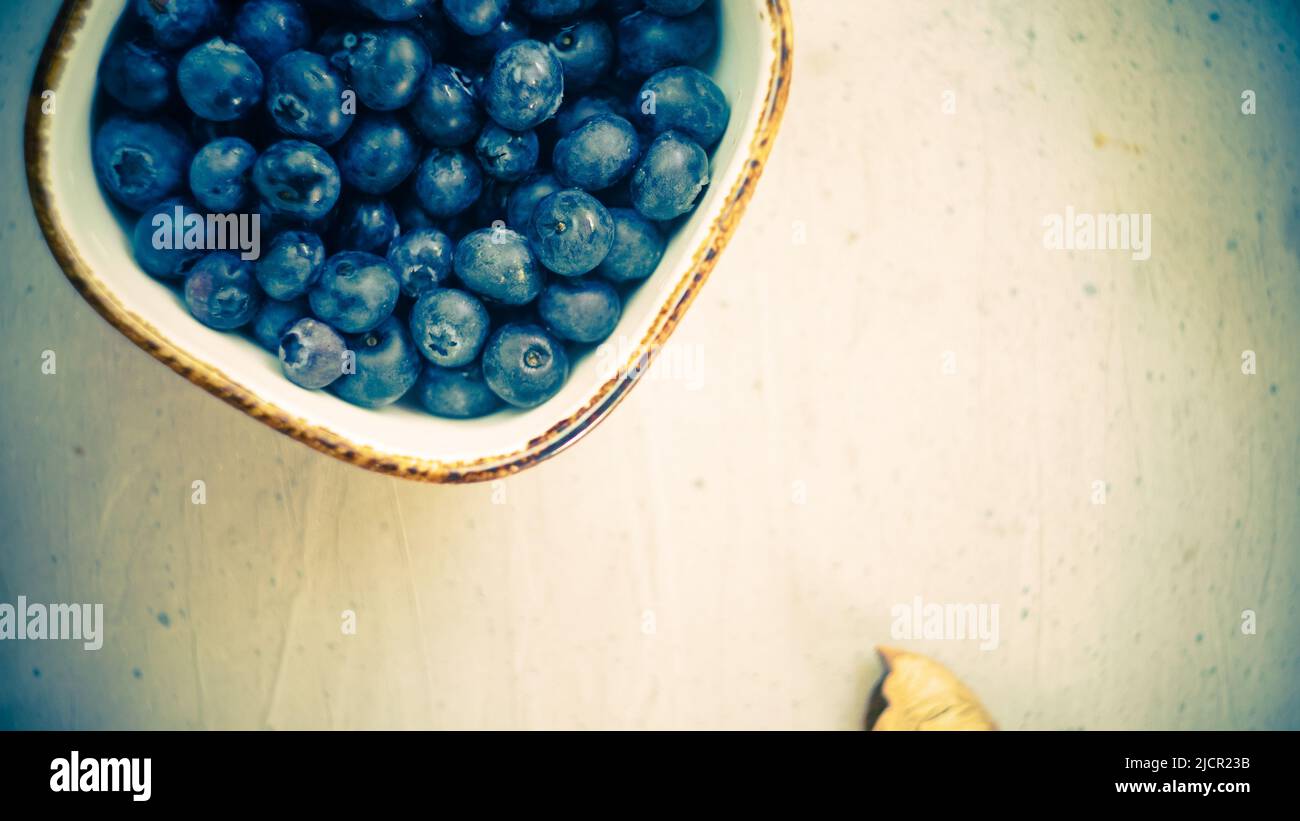 fresh organic blueberries sweet wholesome rustic on wooden table in farm close up top view Stock Photo