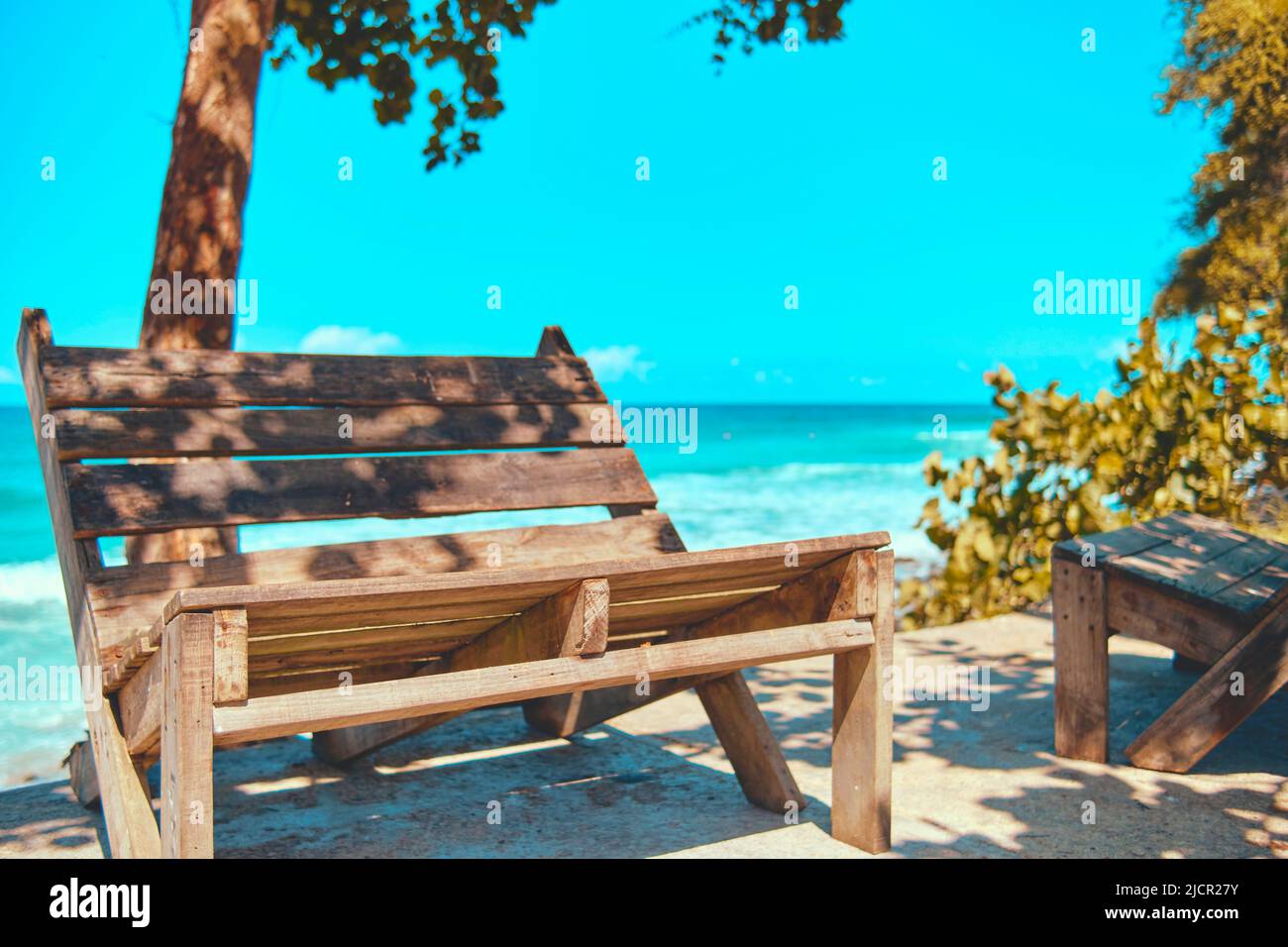 Chairs in relaxation space - chill area for surfers in front of the sea, recycled pallet chairs, Los Caracas, La Guaira Venezuela. Recycling Concept. Stock Photo