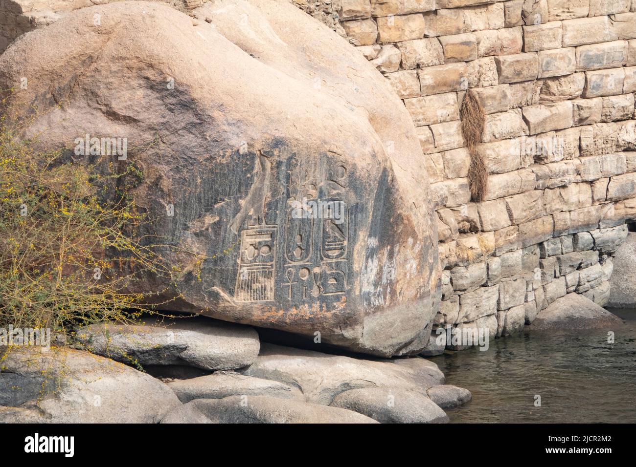 Granite boulders with pharaonic inscriptions, Aswan, Egypt Stock Photo