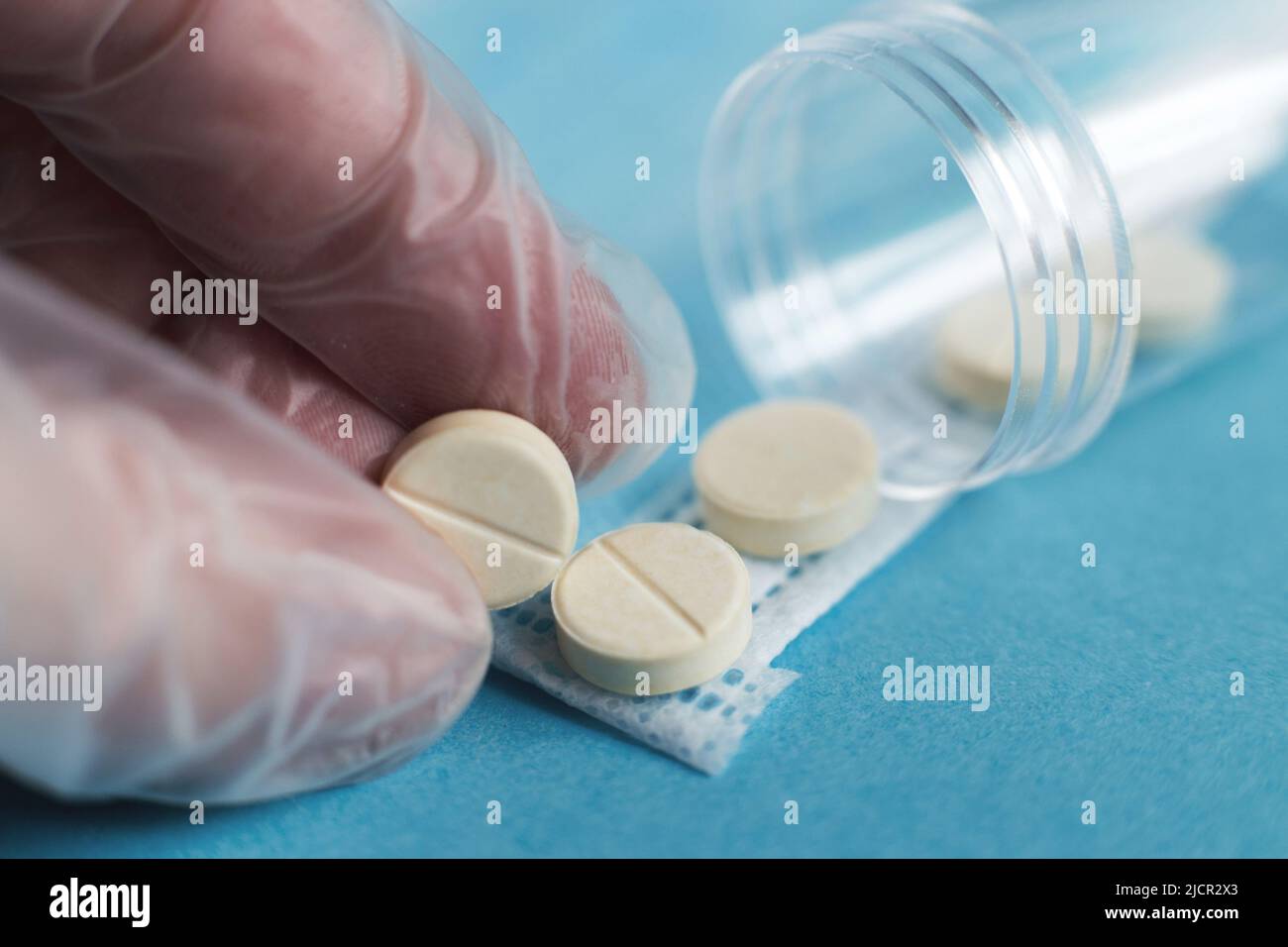 medical tablets close on the blue background. Coronavirus, flu ...