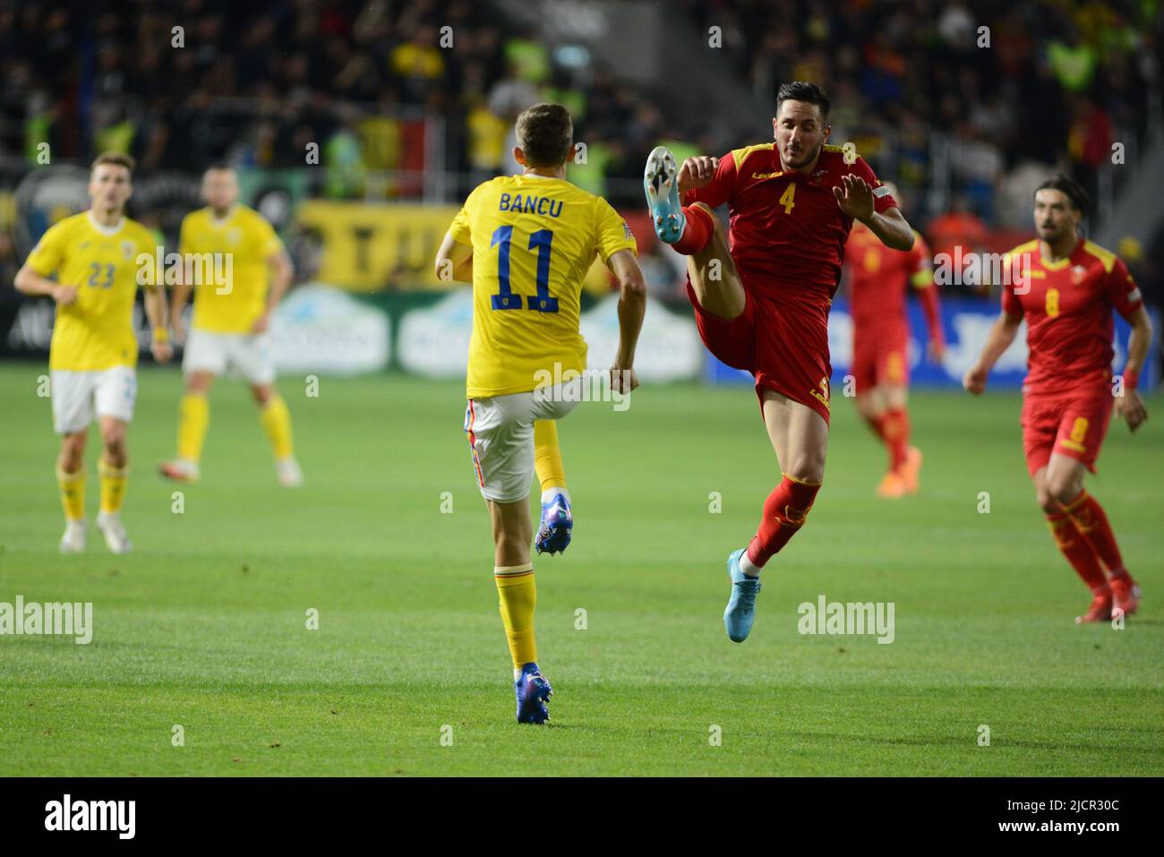 Nicusor Bancu #11 and Marko Vukčević #4 during UEFA Nations League game between Romania and Montenegro , 14.06.2022,  Cristi Stavri Stock Photo