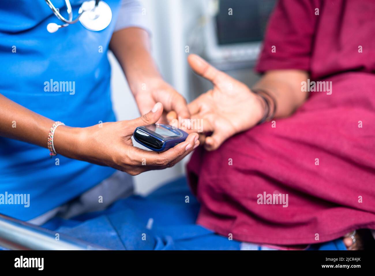 Close up shot of doctor checking sugar or diabetes level of sick woman