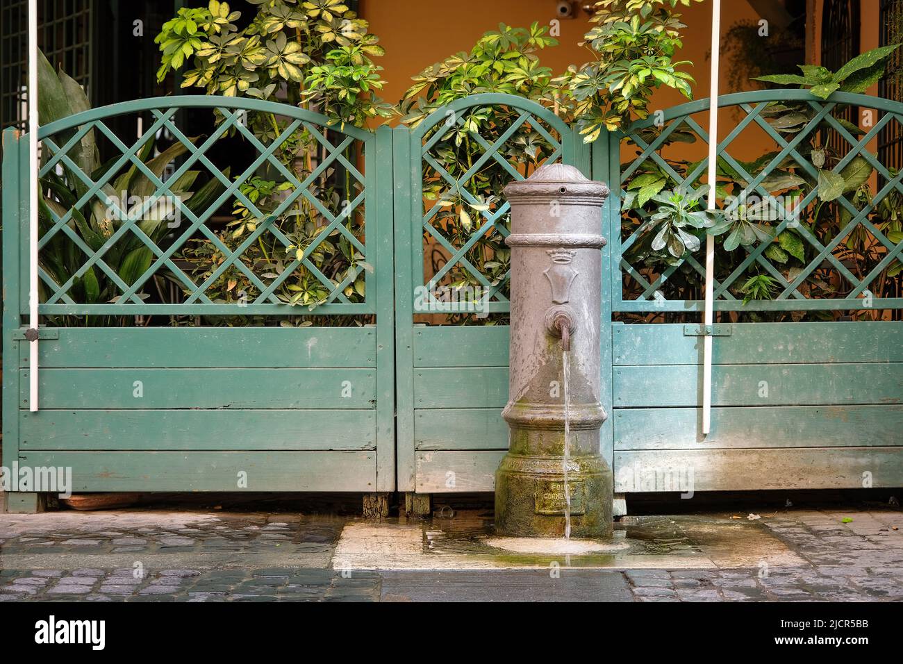 Traditional drinking water fountain in Rome, Italy. Stock Photo