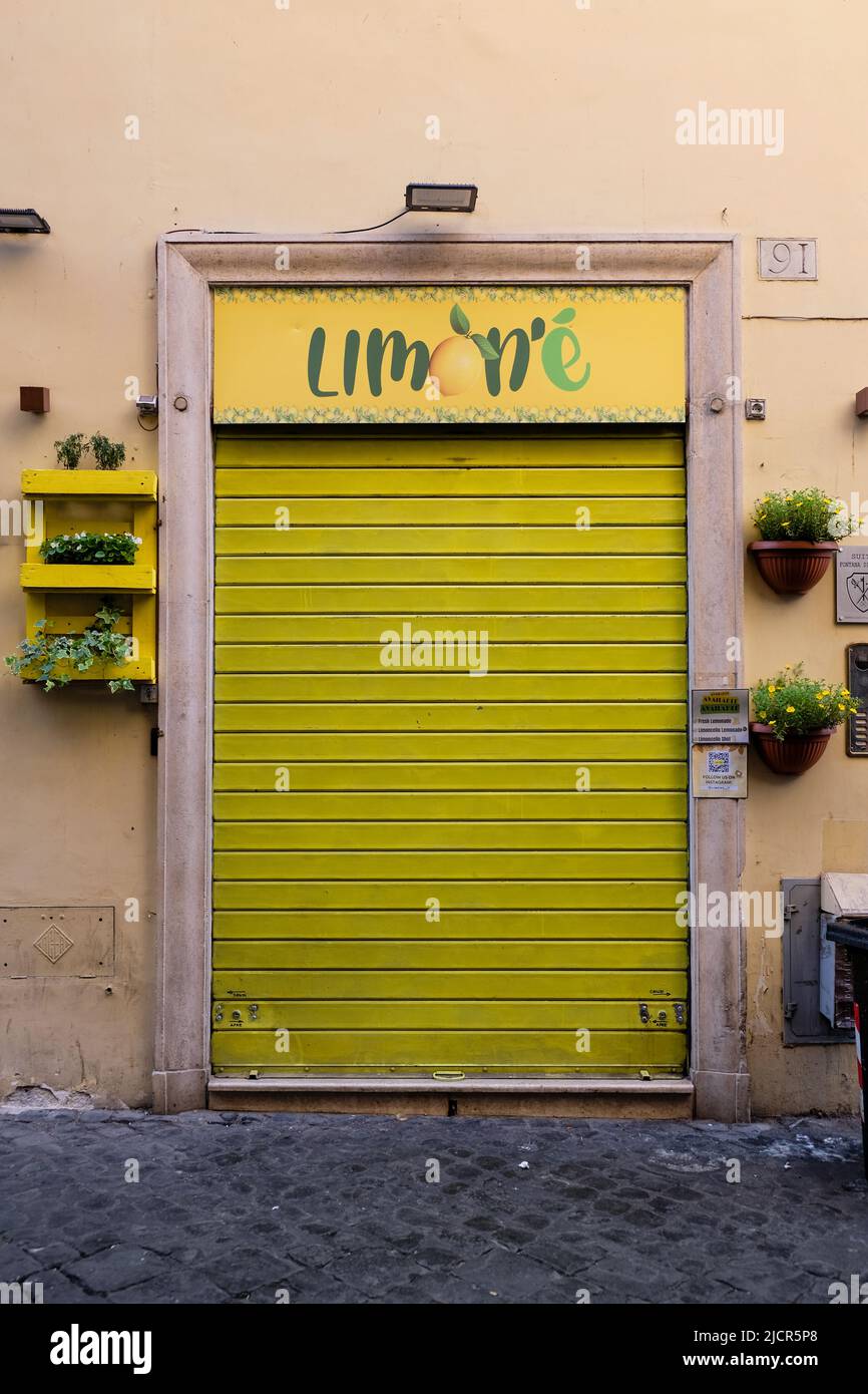 Rome, Italy - June 6, 2022: Colorful shop entrance not yet open for the day in Rome, Italy. Stock Photo