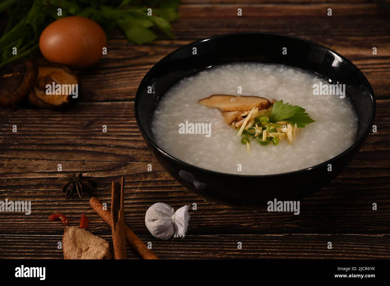 Rice gruel, rice porridge or congee with soft boiled egg, shiitake