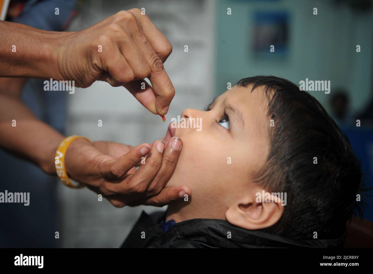 Sylhet, Bangladesh. 15th June 2022. Health care workers giving children the ‘Vitamin A’ capsule