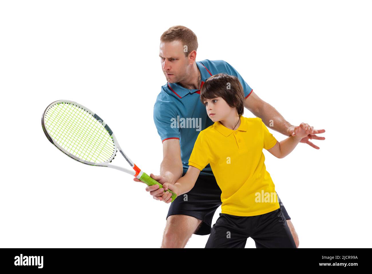 Tennis lesson. Professional tennis player, instructor shows basic