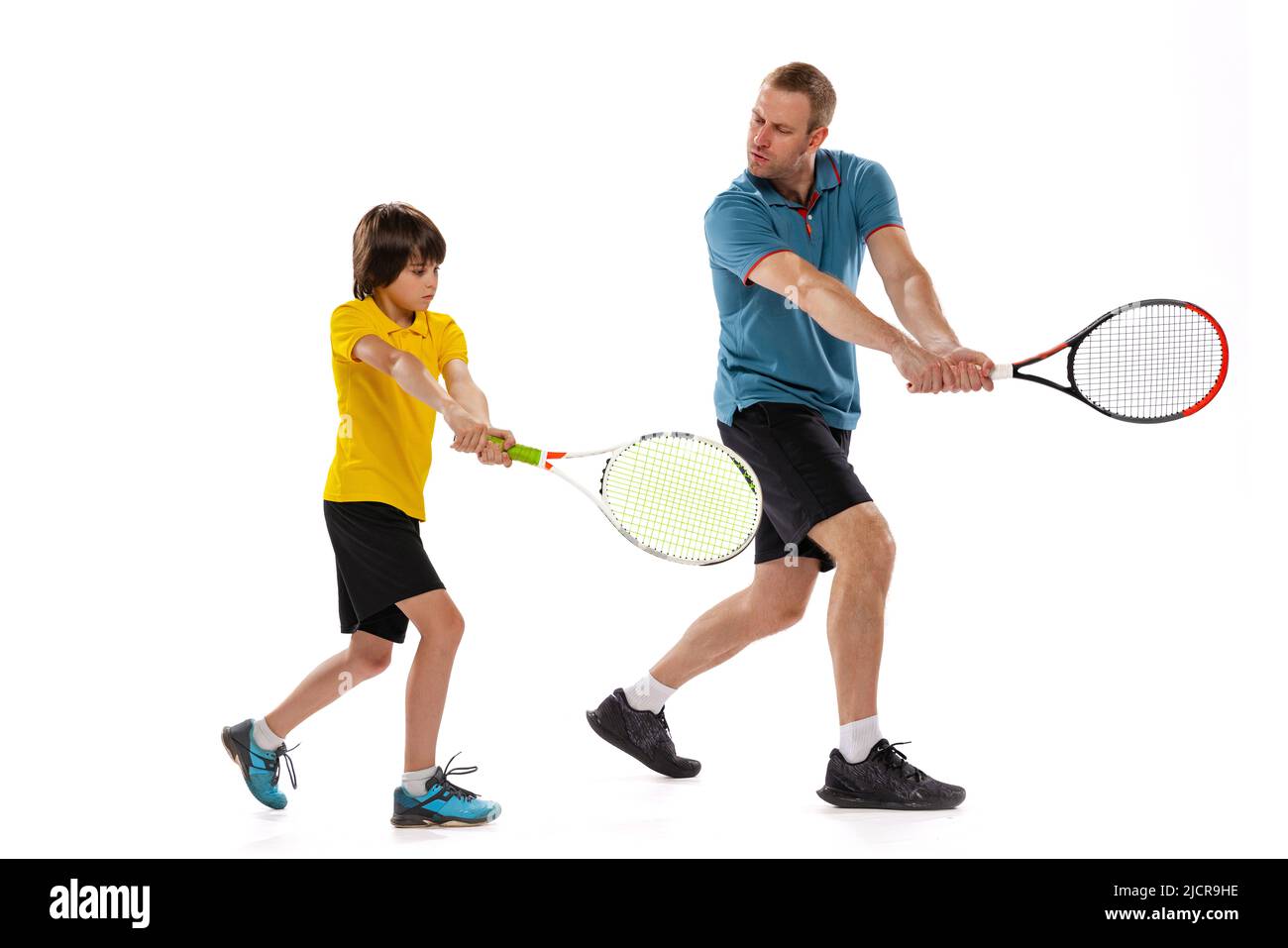Tennis lesson. Professional tennis player, instructor shows basic