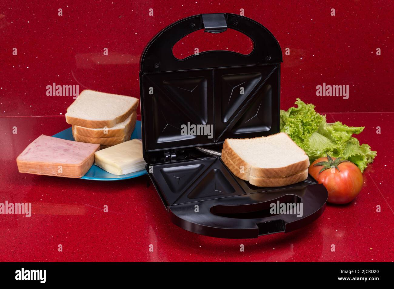 Sandwich maker; photo with ingredients to make sandwiches Stock Photo