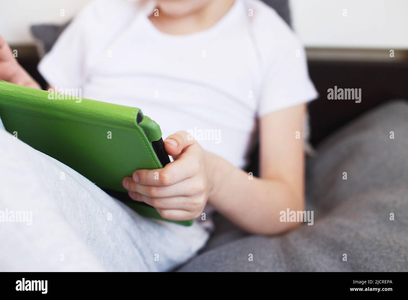 Distance learning online education. Boy sitting with a tablet on the