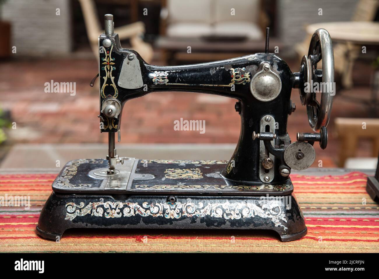 Antiques - Exhibition of an old sewing machine. Stock Photo
