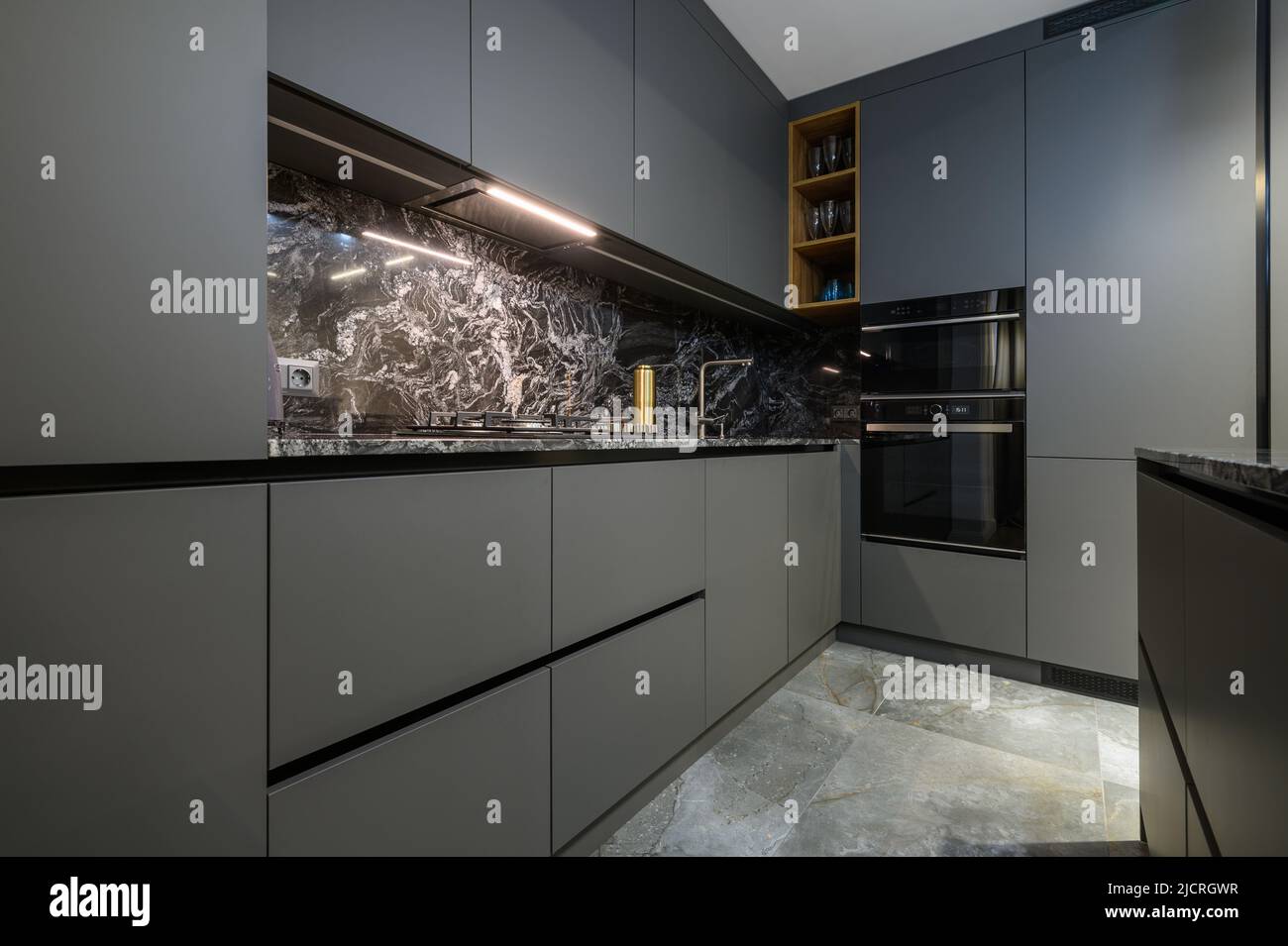 Corner view closeup to grey luxury kitchen Stock Photo
