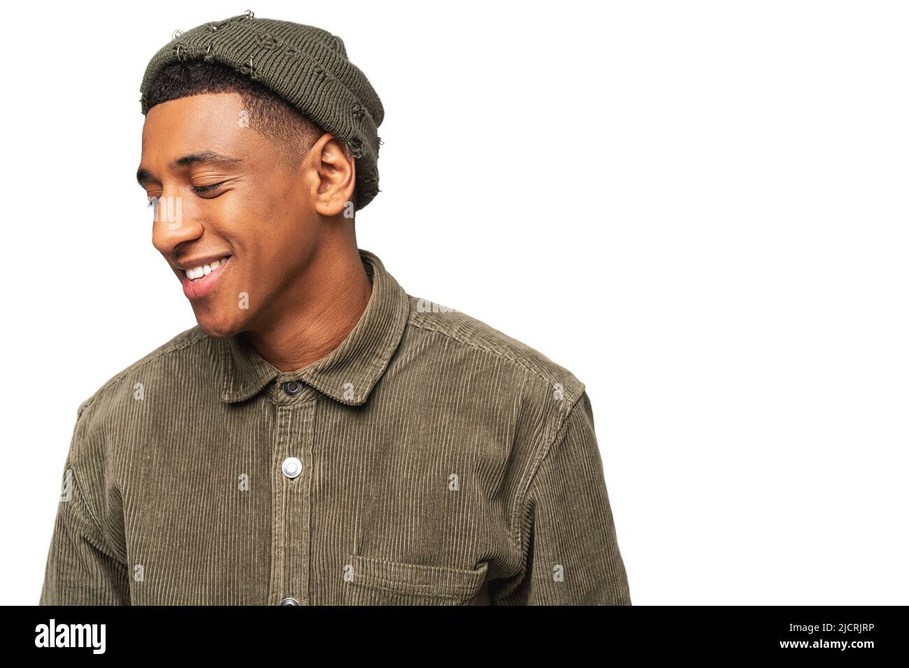 Portrait of happy young African American guy looking away with pleasure smile isolated on white background. Man posing at the studio Stock Photo