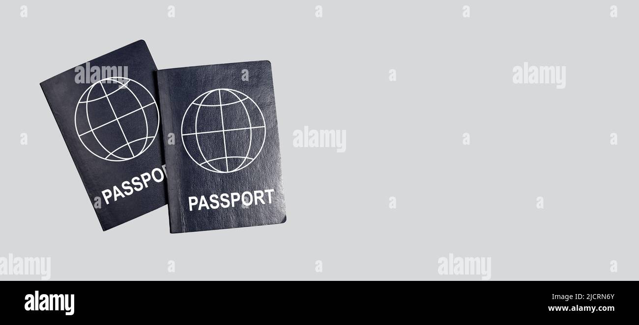 Banner with two abstract global passports on grey background. Joint  vacation, travel together concept. Identity, nationality verification. Copy  space. High quality photo Stock Photo - Alamy