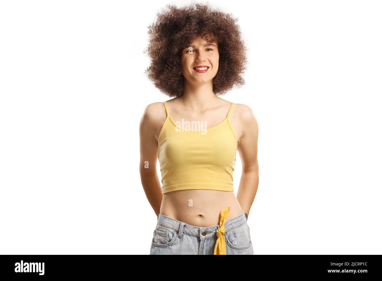Smiling young caucasian woman with afro hairstyle isolated on white background Stock Photo