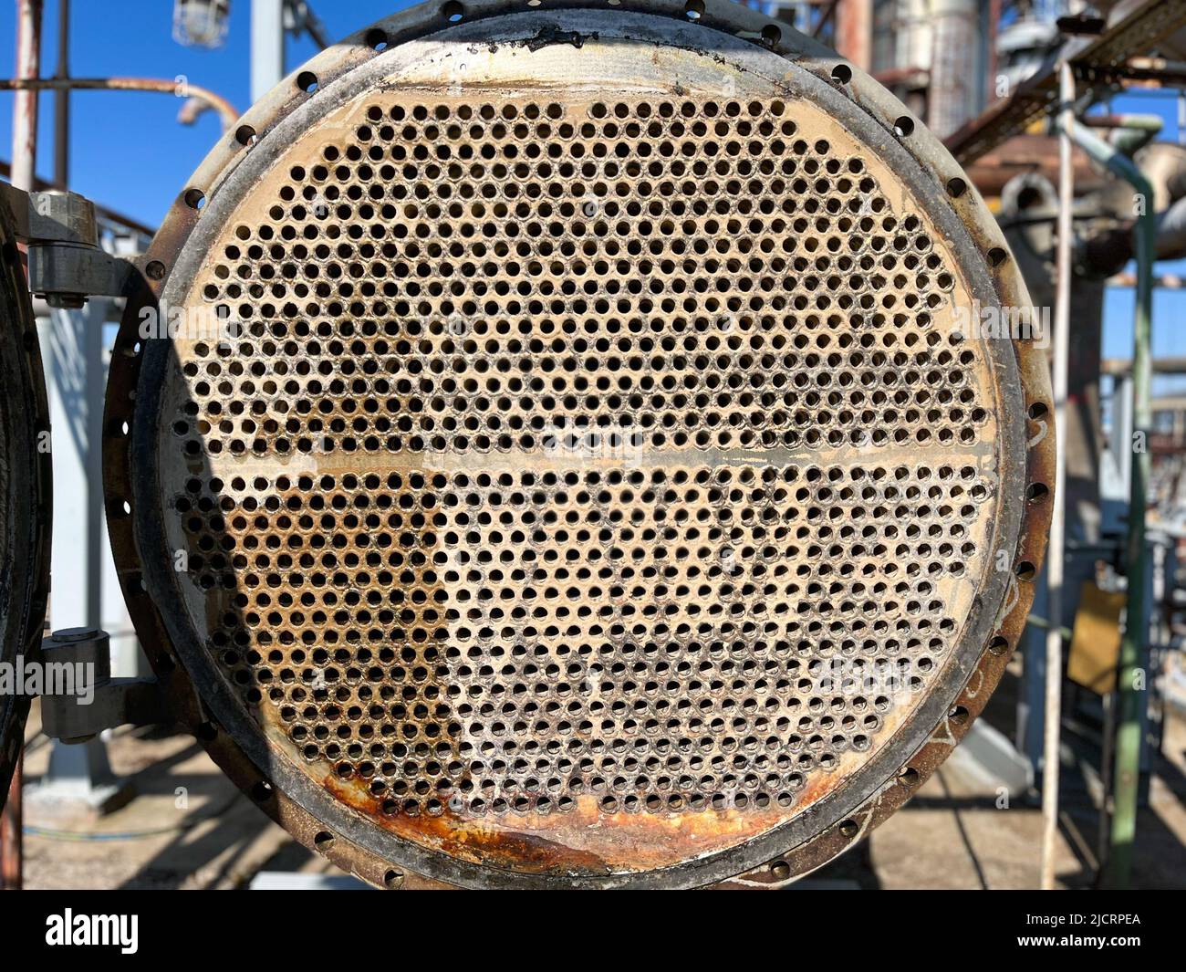 Shell-and-tube (shell-and-tube) heat exchanger for heat exchange between two streams close-up. Heat exchanger tubes in the open Stock Photo