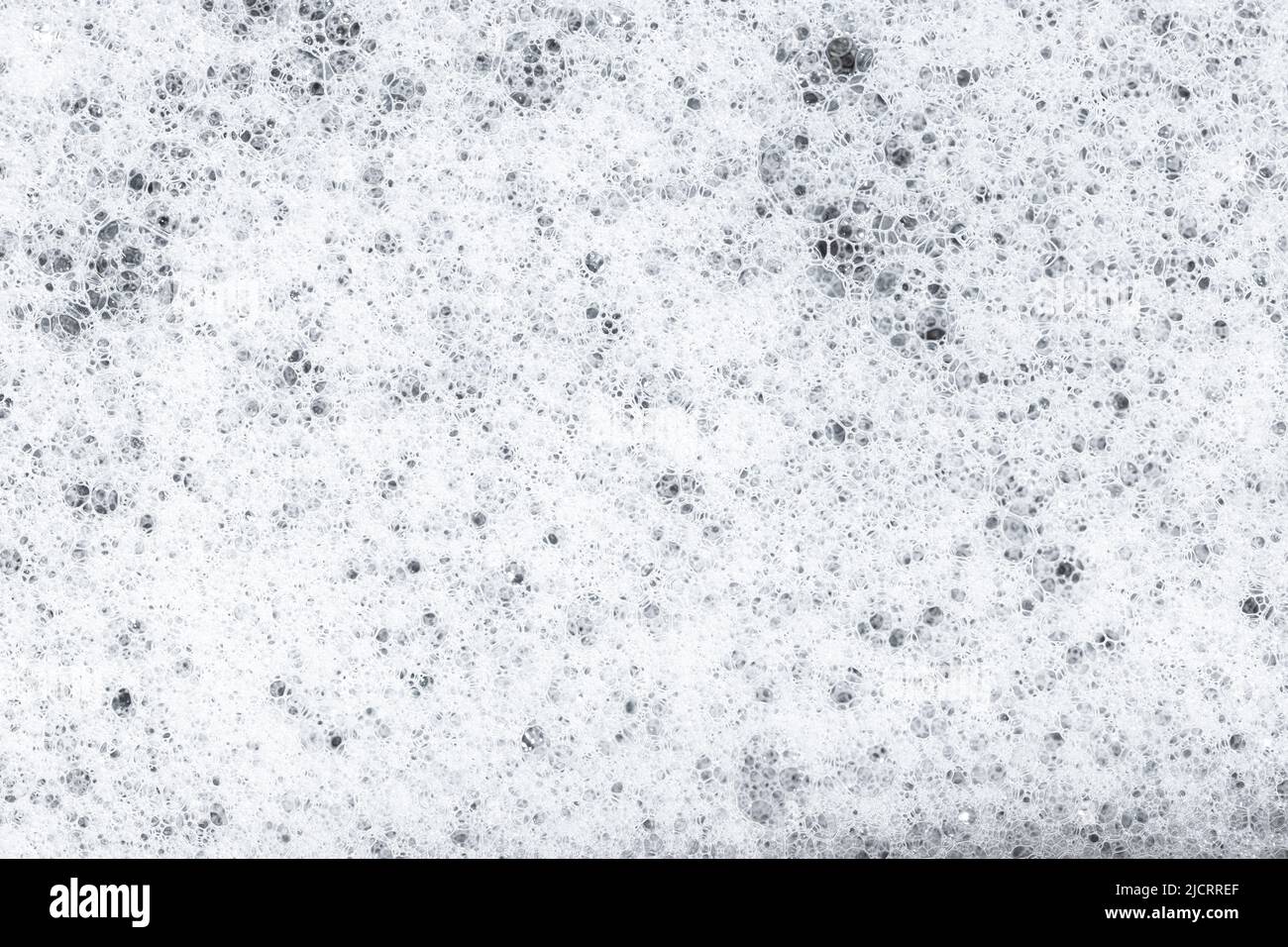 White Soap foam with bubbles background texture. Full frame Stock Photo