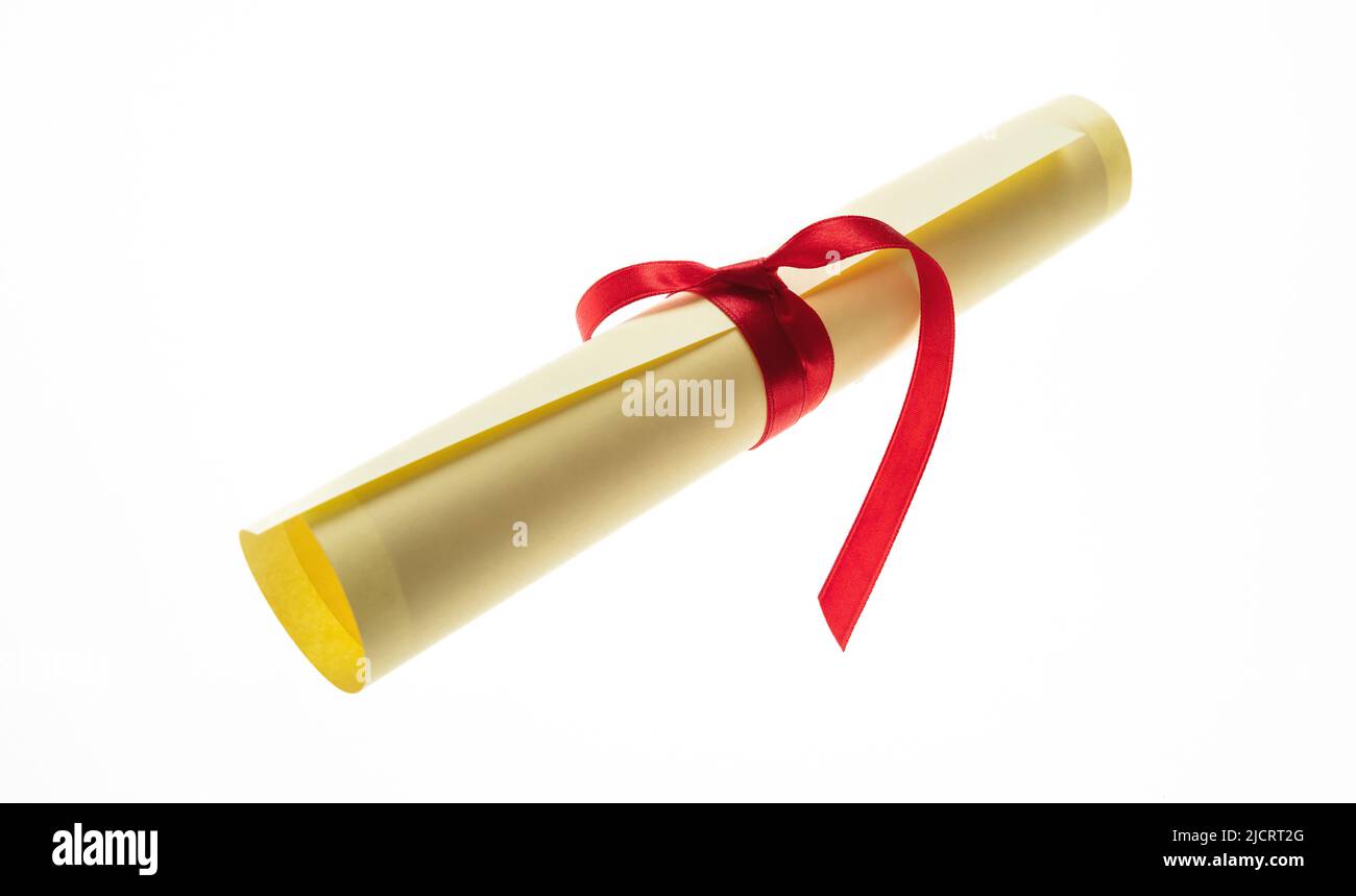 Diploma scroll with red ribbon isolated cutout on white background. College degree paper certificate roll, University graduation, education, studies c Stock Photo