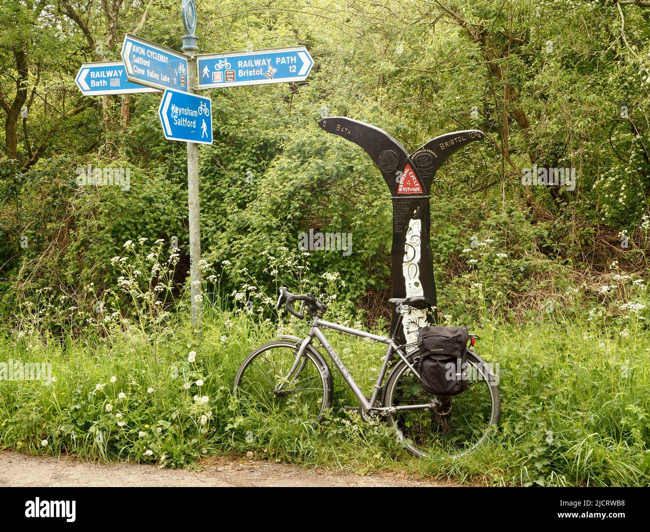 Milennium project milepost on the Bristol to Bath cycle walkway, part of National Cycle Network route 4, following a disused railway line. May 2022. Stock Photo