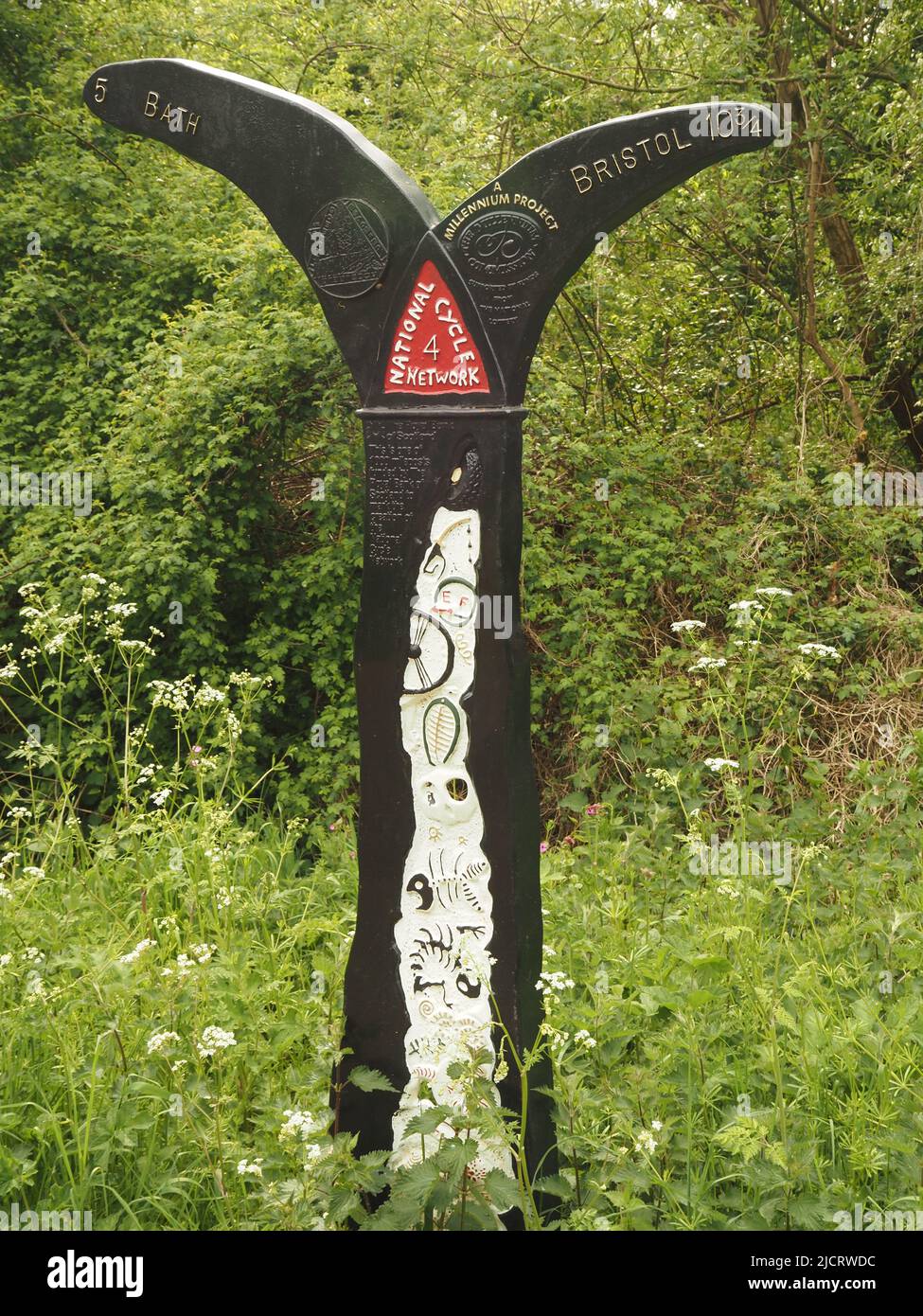 Milennium project milepost on the Bristol to Bath cycle walkway, part of National Cycle Network route 4, following a disused railway line. May 2022. Stock Photo