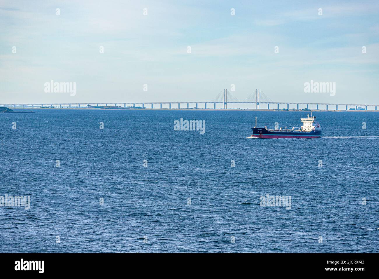 The oil/chemical tanker 'Wisby Wave' passing Øresund Bridge between Copenhagen, Denmark and Malmo, Sweden Stock Photo