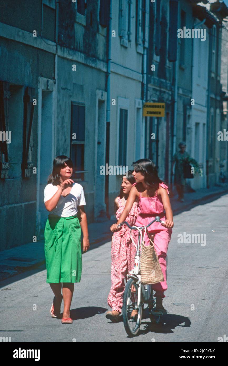 Young girls playing in the street in 1980, Aigues Mortes, Gard, France Stock Photo